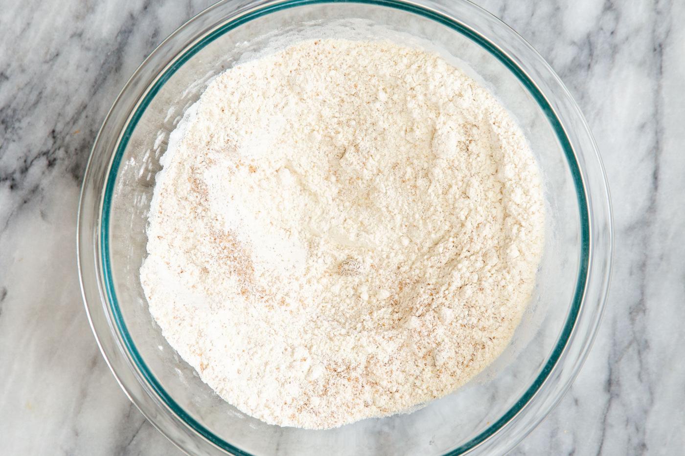 dry cake ingredients in a glass bowl