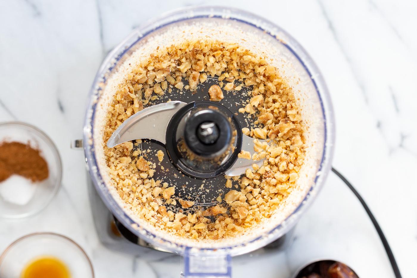Walnuts in a food processor for our carrot cake bites