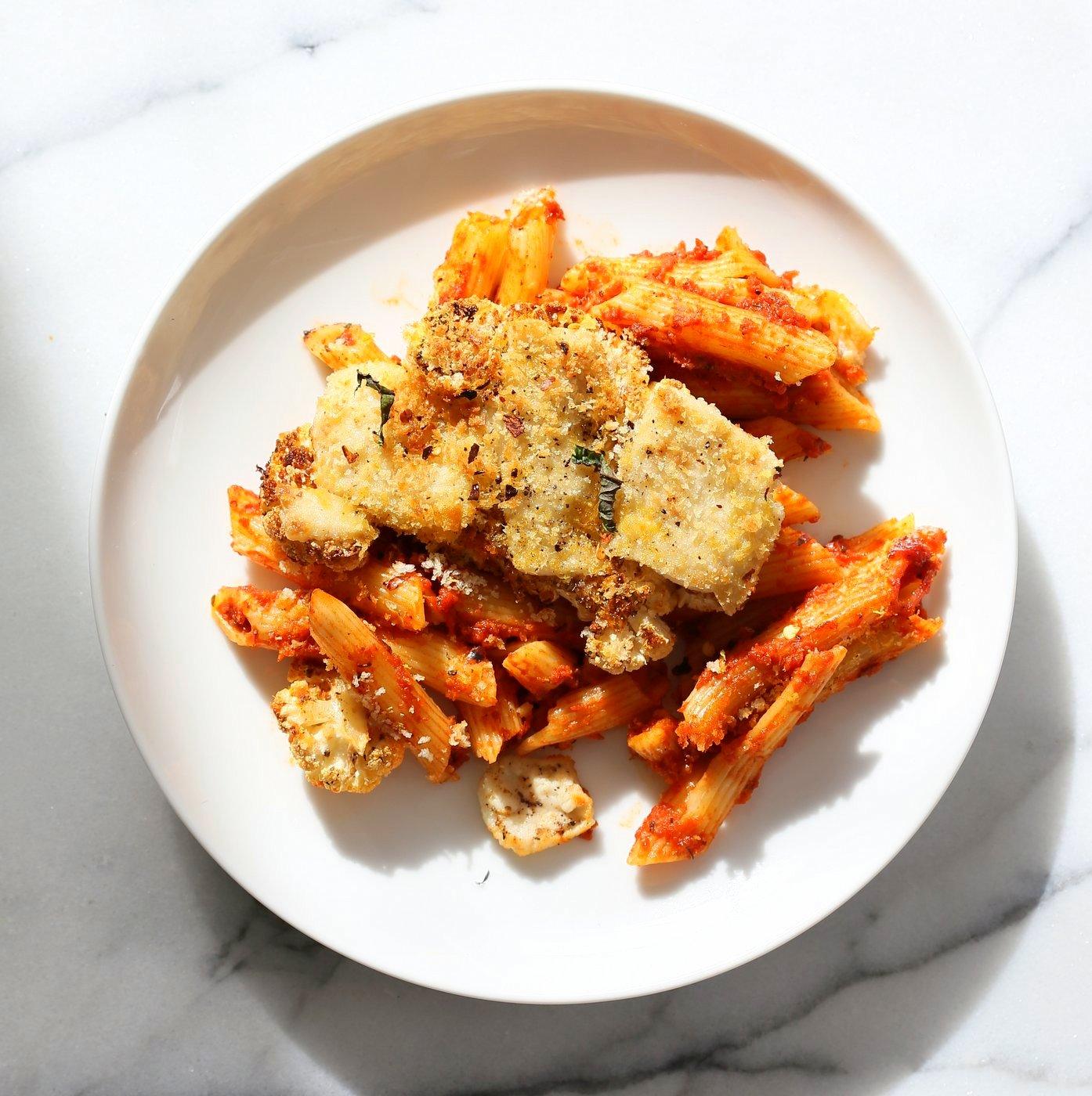 Vegan Cauliflower Parmesan Pasta Bake. Pasta, marinara sauce, Crispy Cauliflower slices coated in breadcrumbs and spices, and vegan mozzarella. Soy-free Recipe. Can be gluten-free | VeganRicha.com