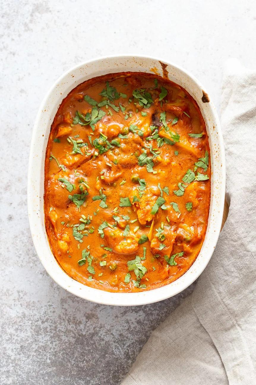 Vegan Cauliflower Pea Curry - 1 Pot Gobi Matar masala. This cauliflower peas curry gets baked in the oven. Creamy roasted flavors without standing around roasting the sauce. #Vegan #Glutenfree #Nutfree #Soyfree #Recipe #VeganRicha #gobimatar #cauliflowerpeacurry . Add some cooked chickpeas to make a meal