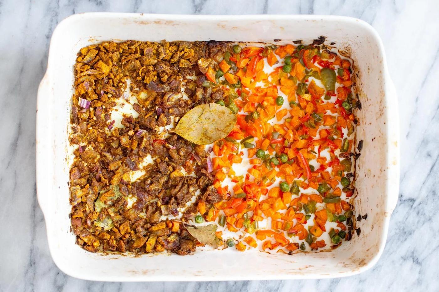 roasted spiced vegetables in a white casserole