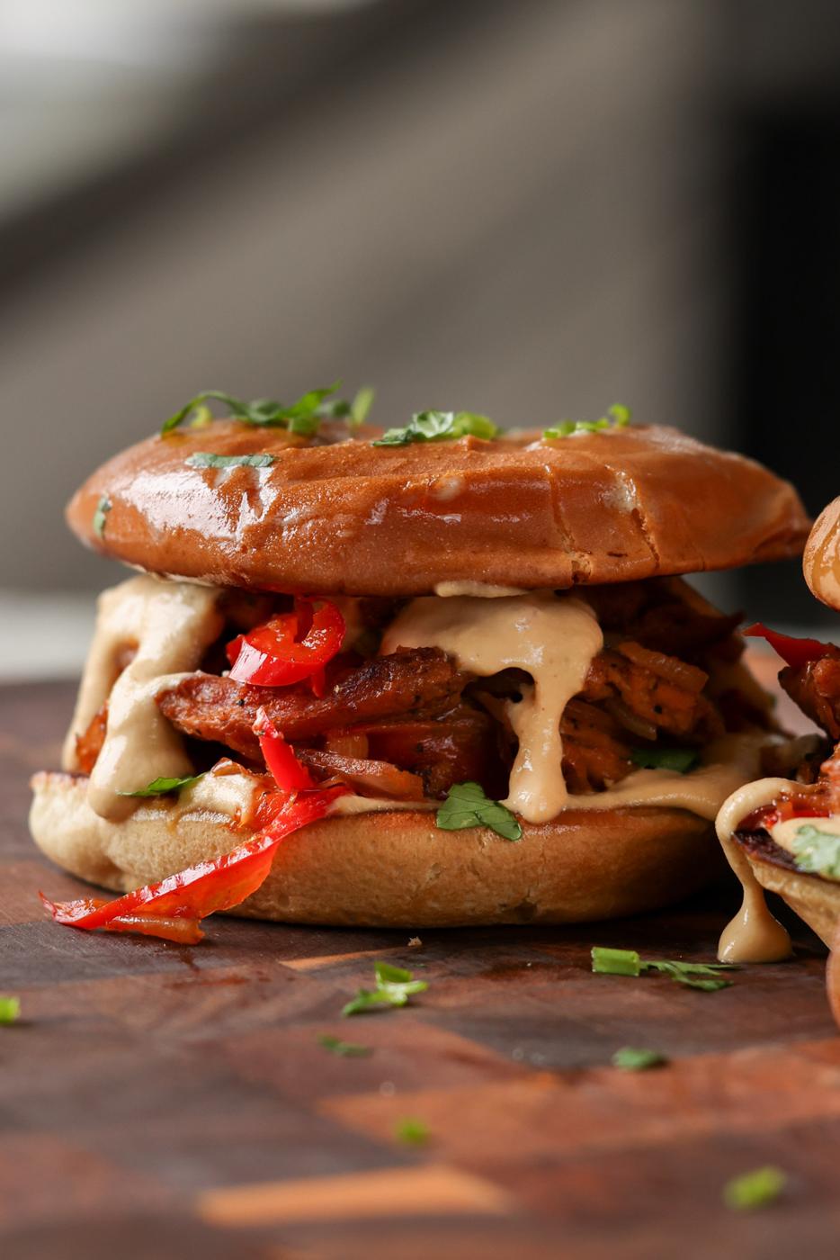 vegan cheesesteak sandwich on a cutting board