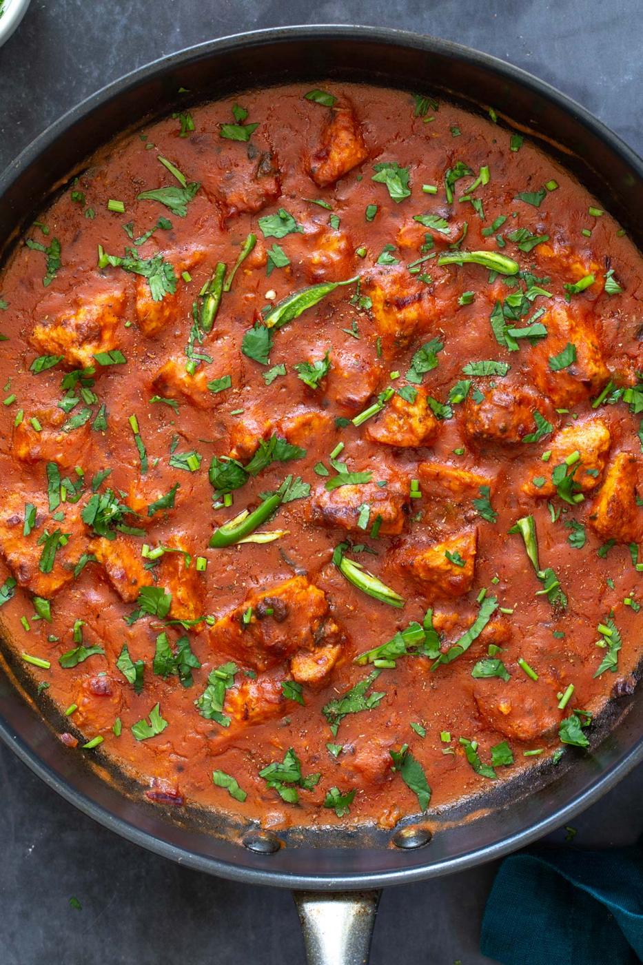 vegan chicken changezi with tofu in a black skillet
