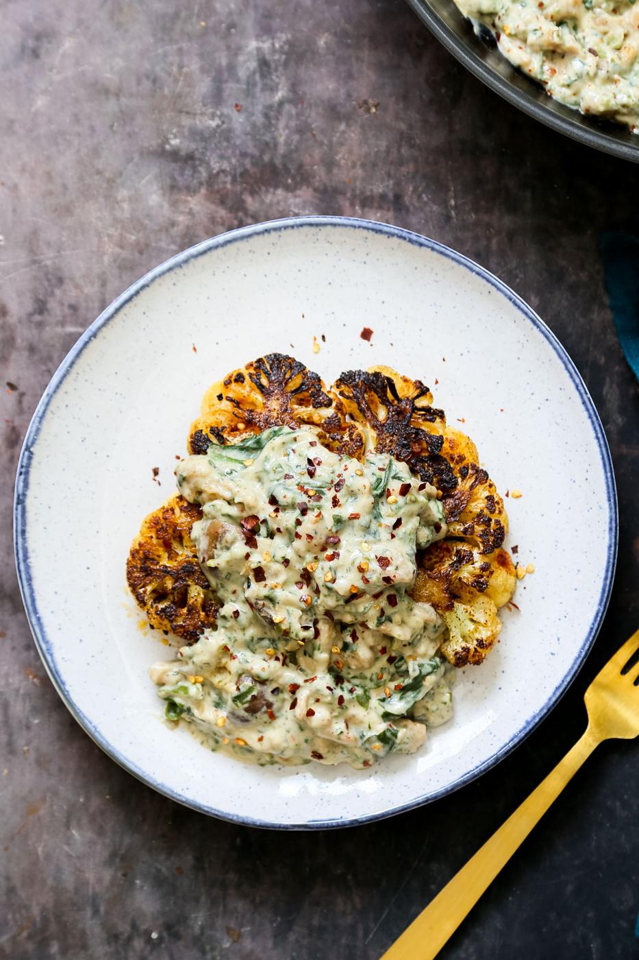 cauliflower steak topped with vegan soycurl florentine sprinkled with red pepper flakes