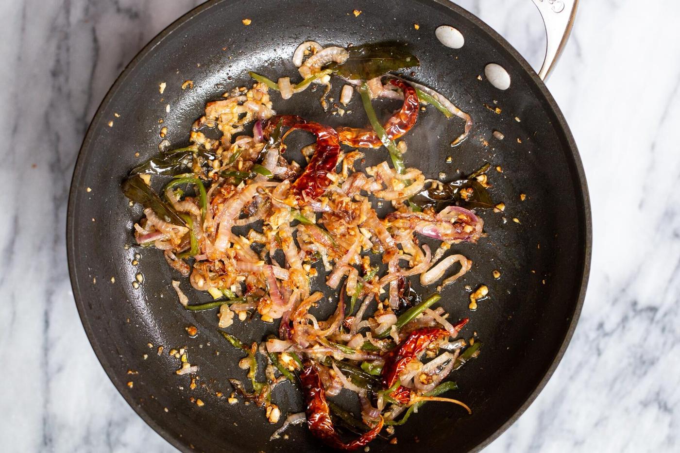 sauteed spices, ginger, onion and garlic in a sauteeing pan