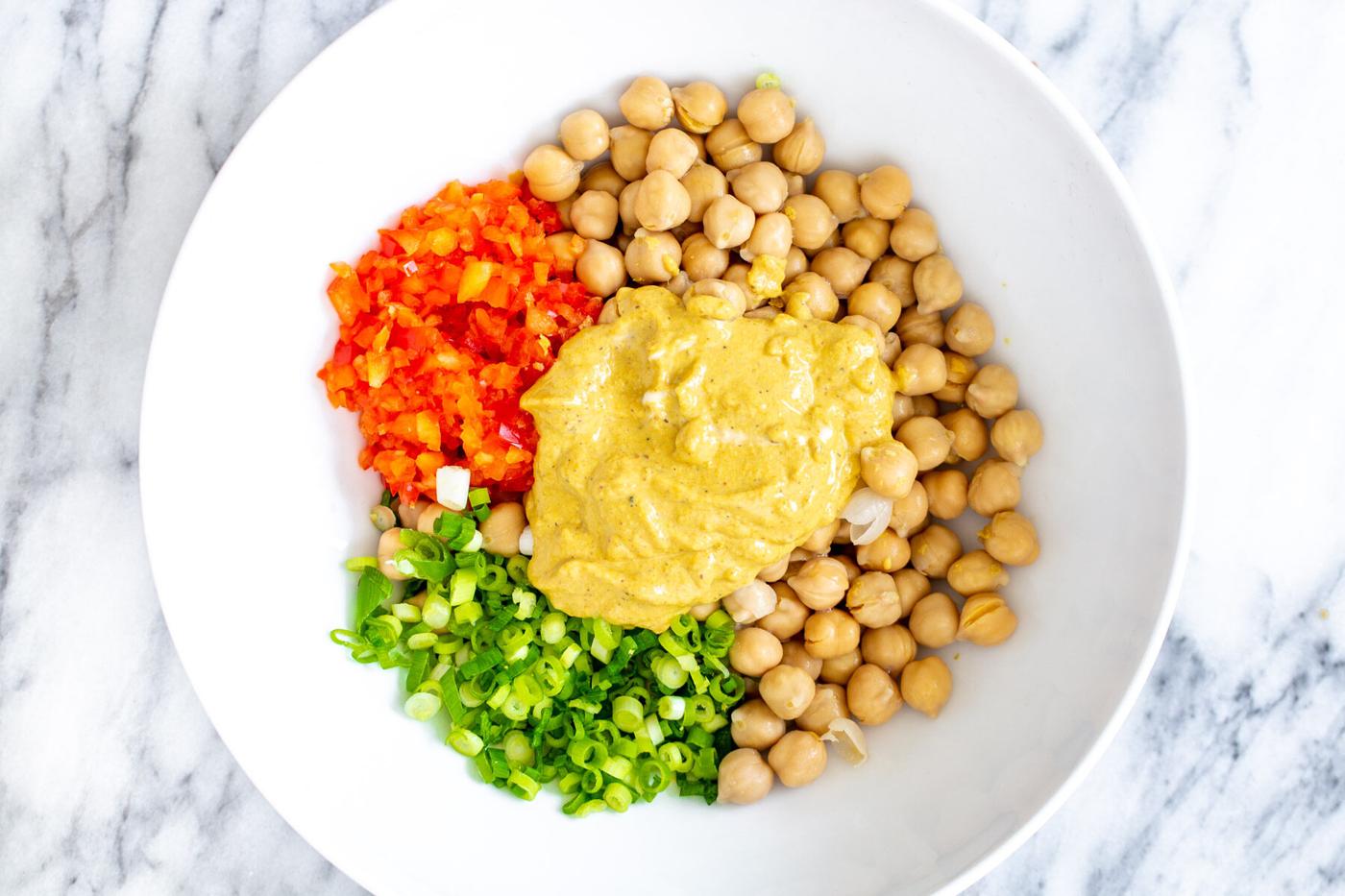 ingredients for vegan chickpea scramble in a white bowl