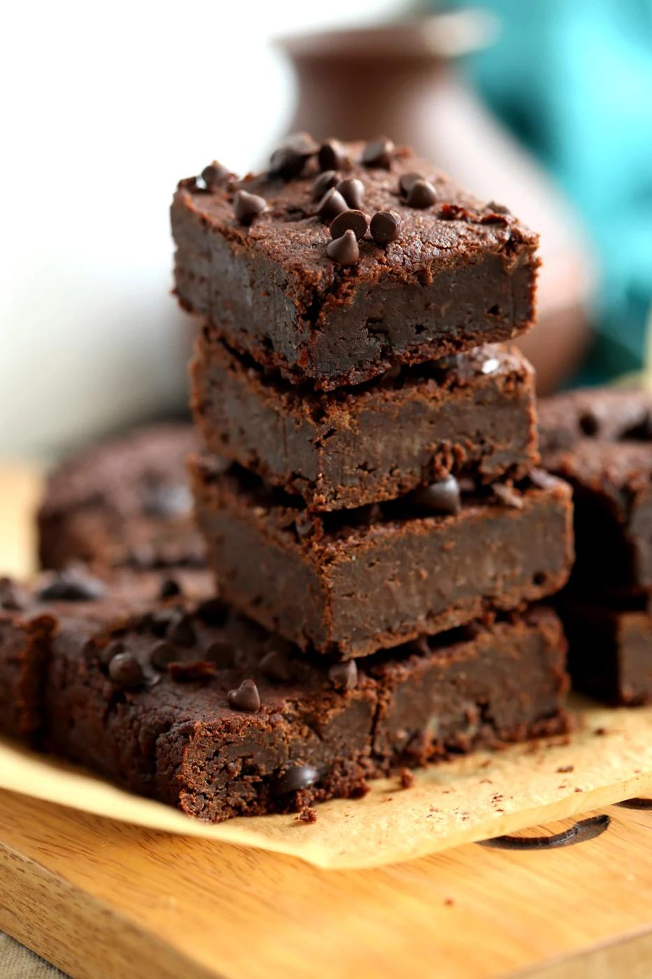Vegan Chickpea Brownies Sliced and stacked on Wood board