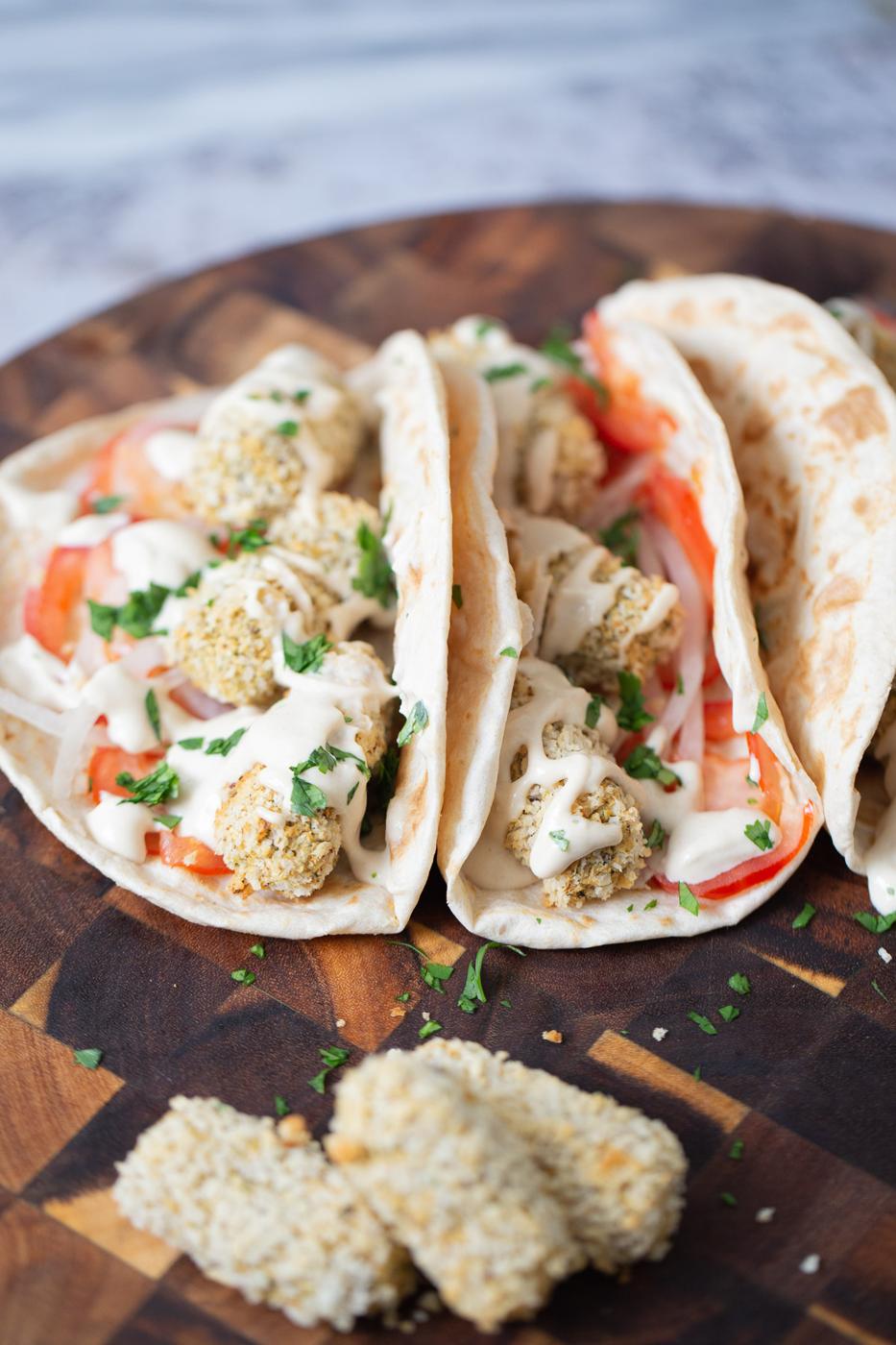 close-up of wraps filled with vegan croquettes and veggies