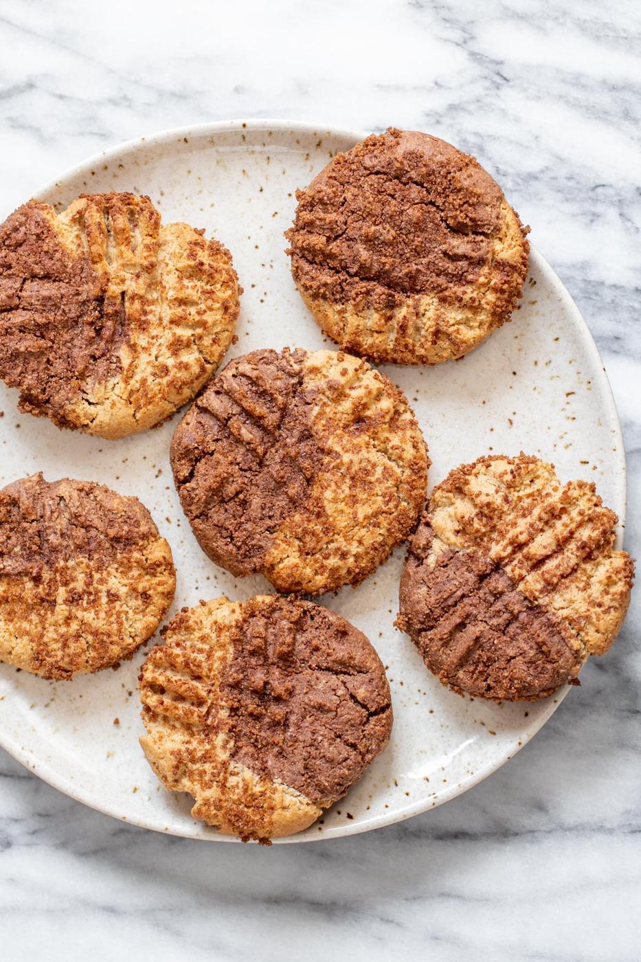 overhead shot of a plate with vegan pumpkin spice snickerdoodle cookies on a plate