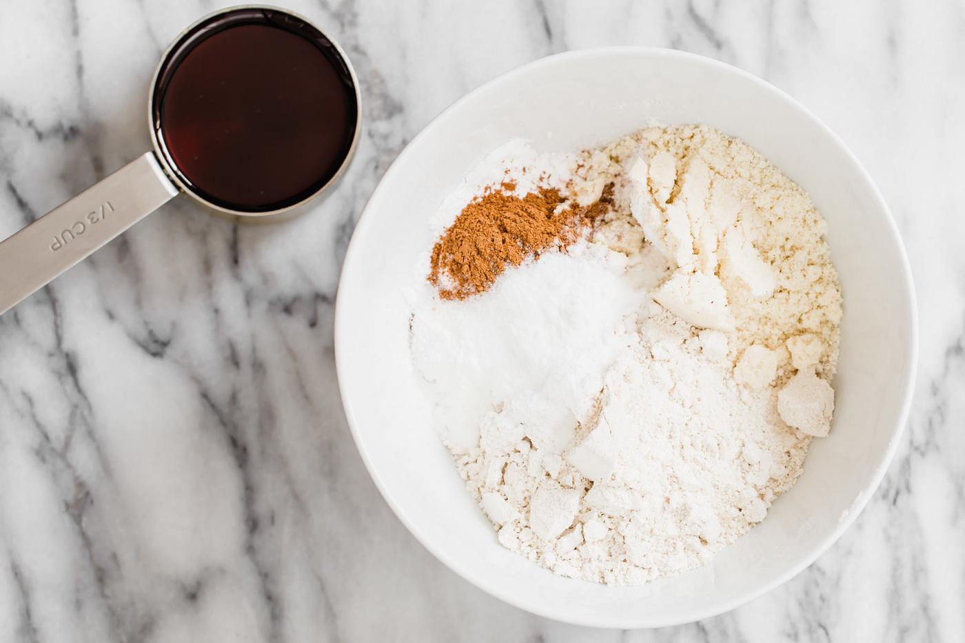 dry ingredients for pumpkin spice snickerdoodles being mixed in a bowl