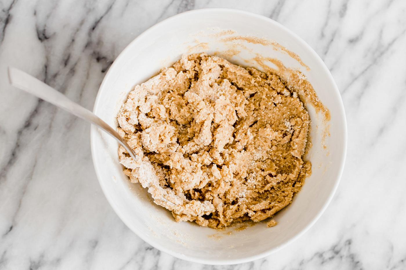 vegan pumpkin spice snickerdoodle cookie dough in a white bowl