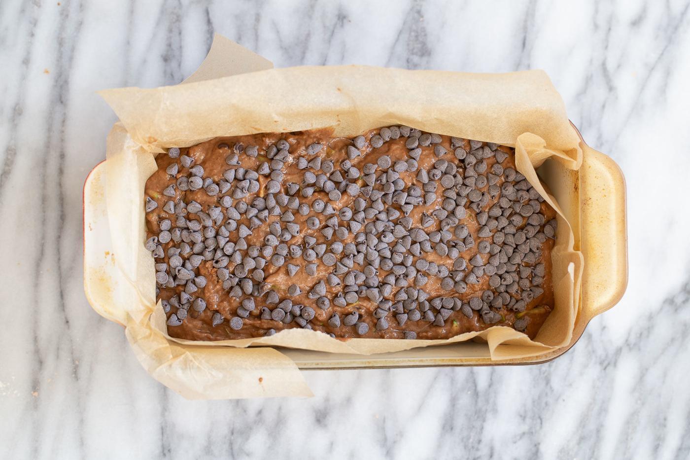 raw unbaked vegan chocolate zucchini bread sprinkled with chocolate chips