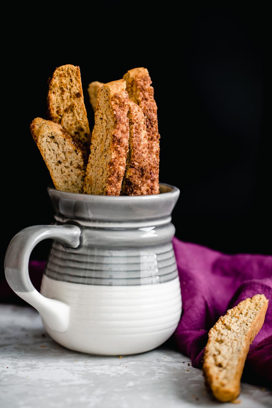 homemade vegan cinnamon sugar biscotti in a small coffee mug