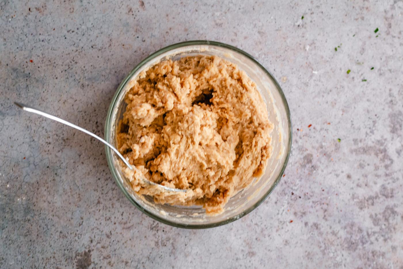 vegan churro biscotti dough in a small glass bowl
