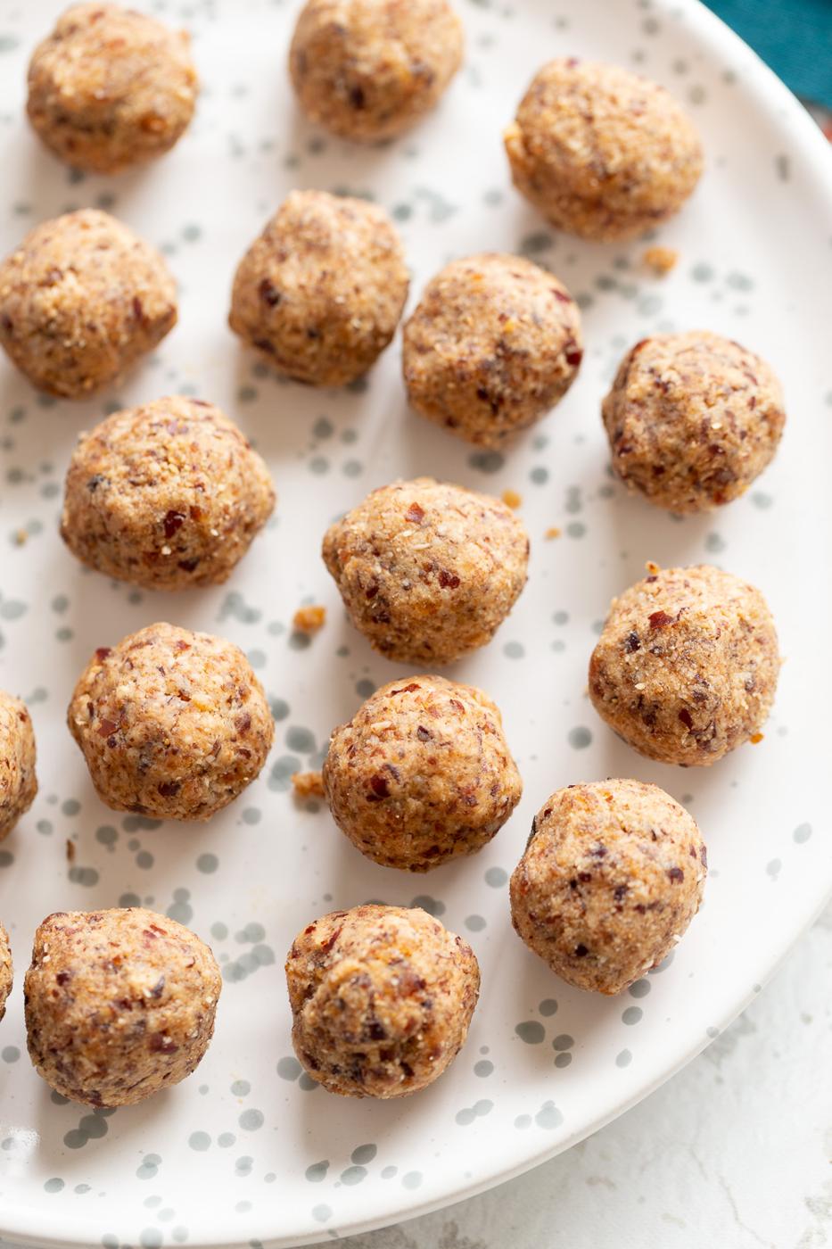 overhead shot of a plate of vegan coconut balls