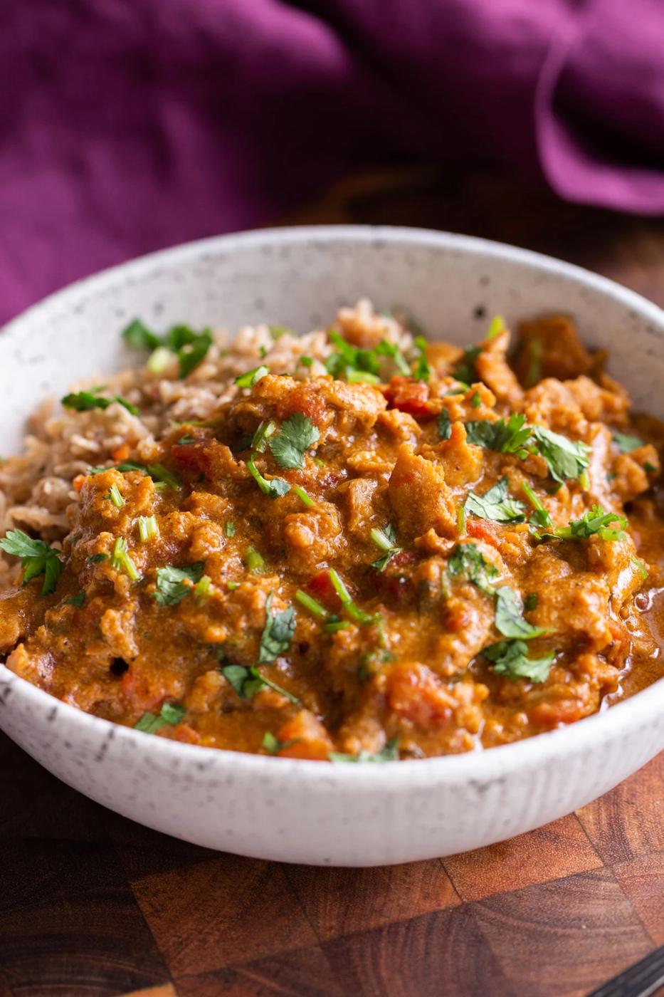 a bowl with Intant Pot coconut chicken Curry Served with rice