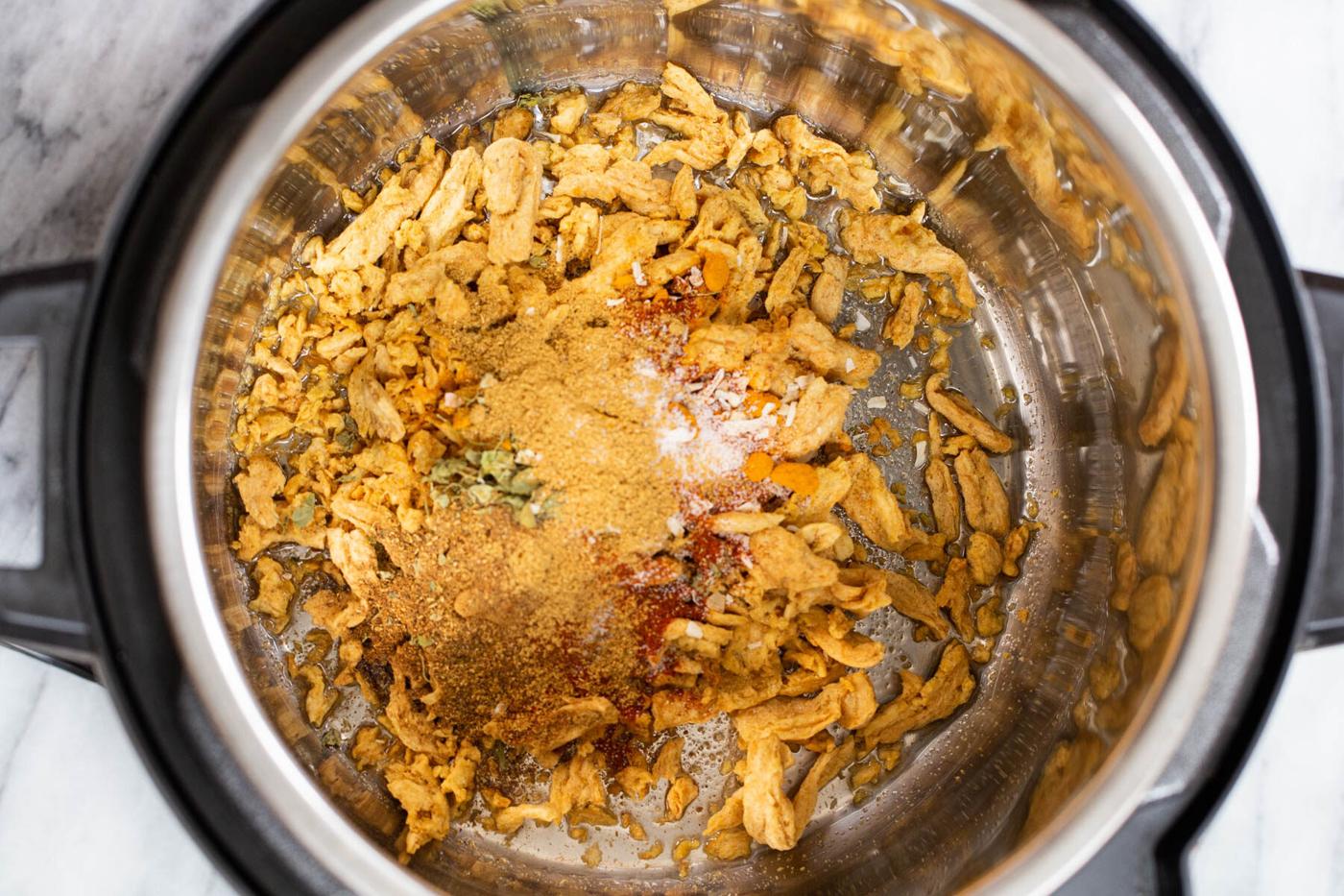 Instant Pot with soy curls and other curry ingredients