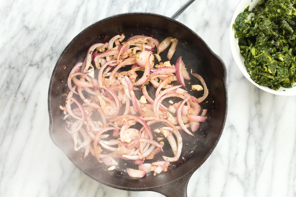 onion and garlic in cast iron skillet