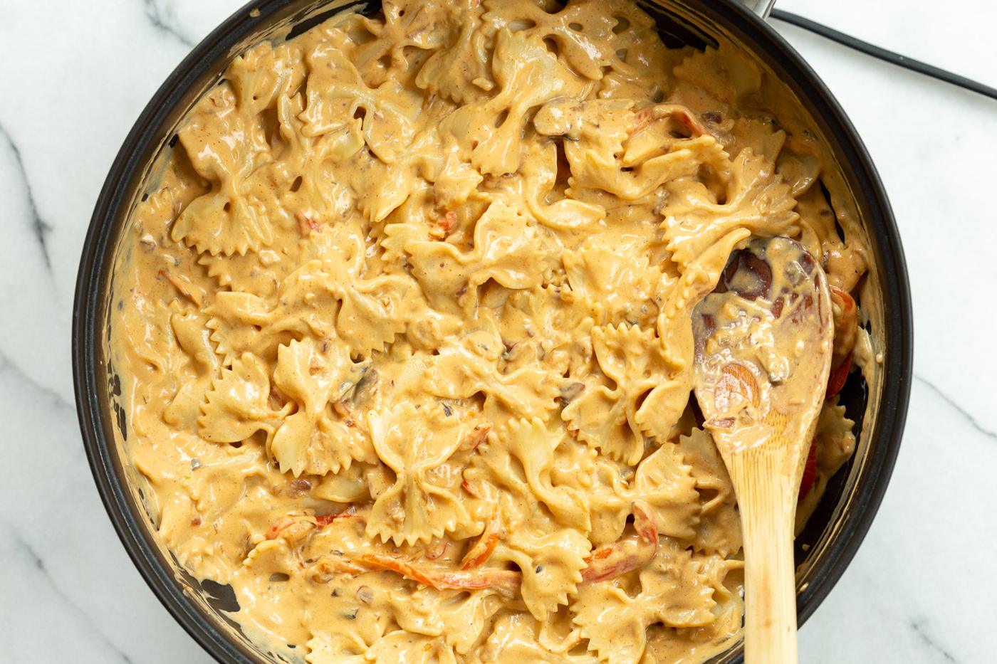 Our Creamy Cajun Pasta Sauce with farfalle in a skillet