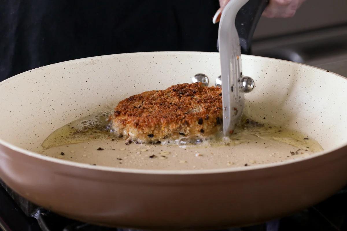 crispy vegan chicken cutlet in the frying pan