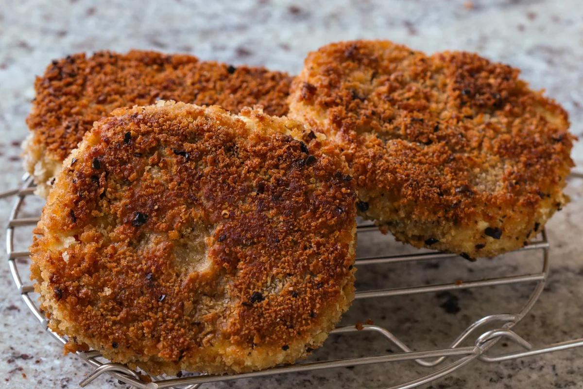crispy vegan chicken cutlets on a wire rack