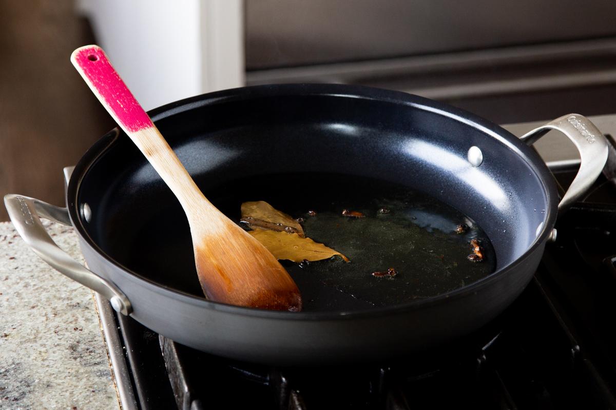 toasting the whole spices in the frying pan