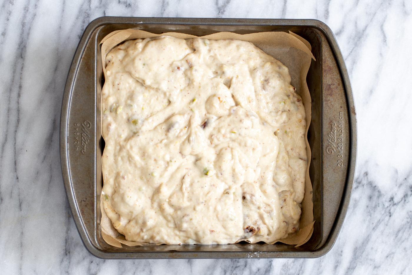 vegan date nut cake batter in a cake pan