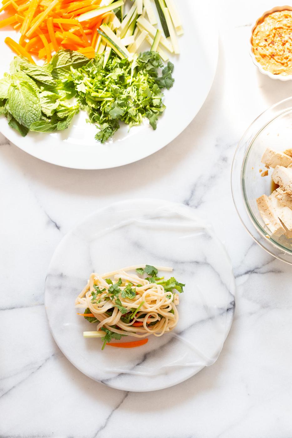 Assembly process of our vegan Fresh Spring rolls on marble