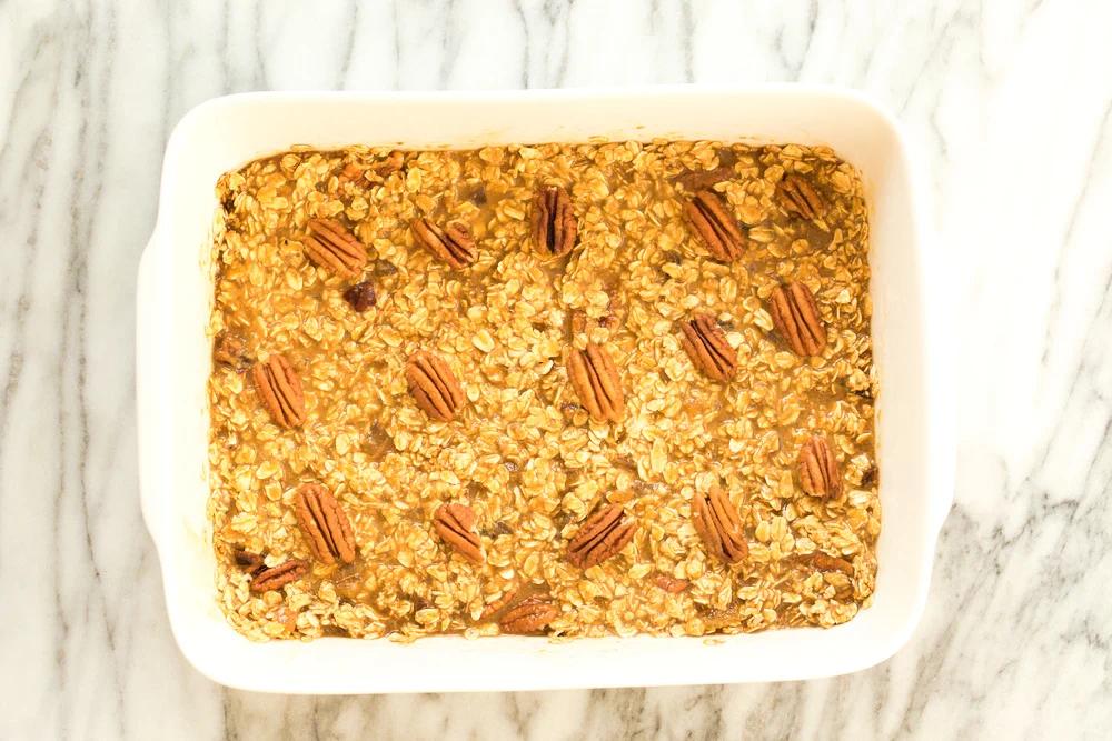 Vegan Gingerbread Baked Oatmeal in a white baking dish