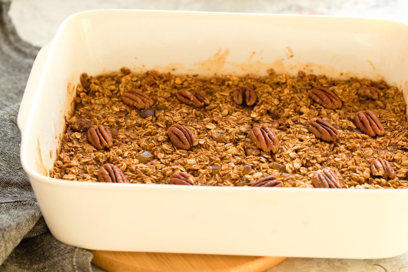 Vegan Gingerbread Baked Oatmeal in a white baking dish