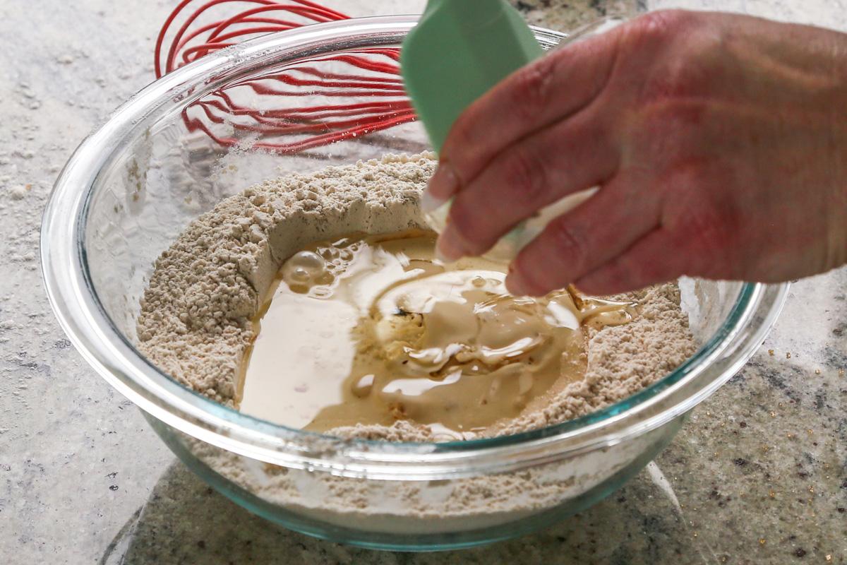 adding the remaining wet ingredients to the well in the dry ingredients