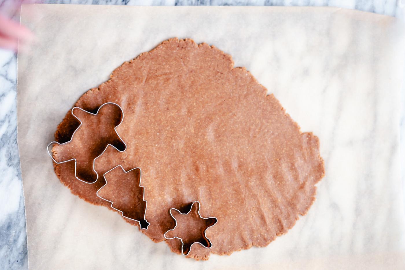 vegan gingerbread cookies being cut out