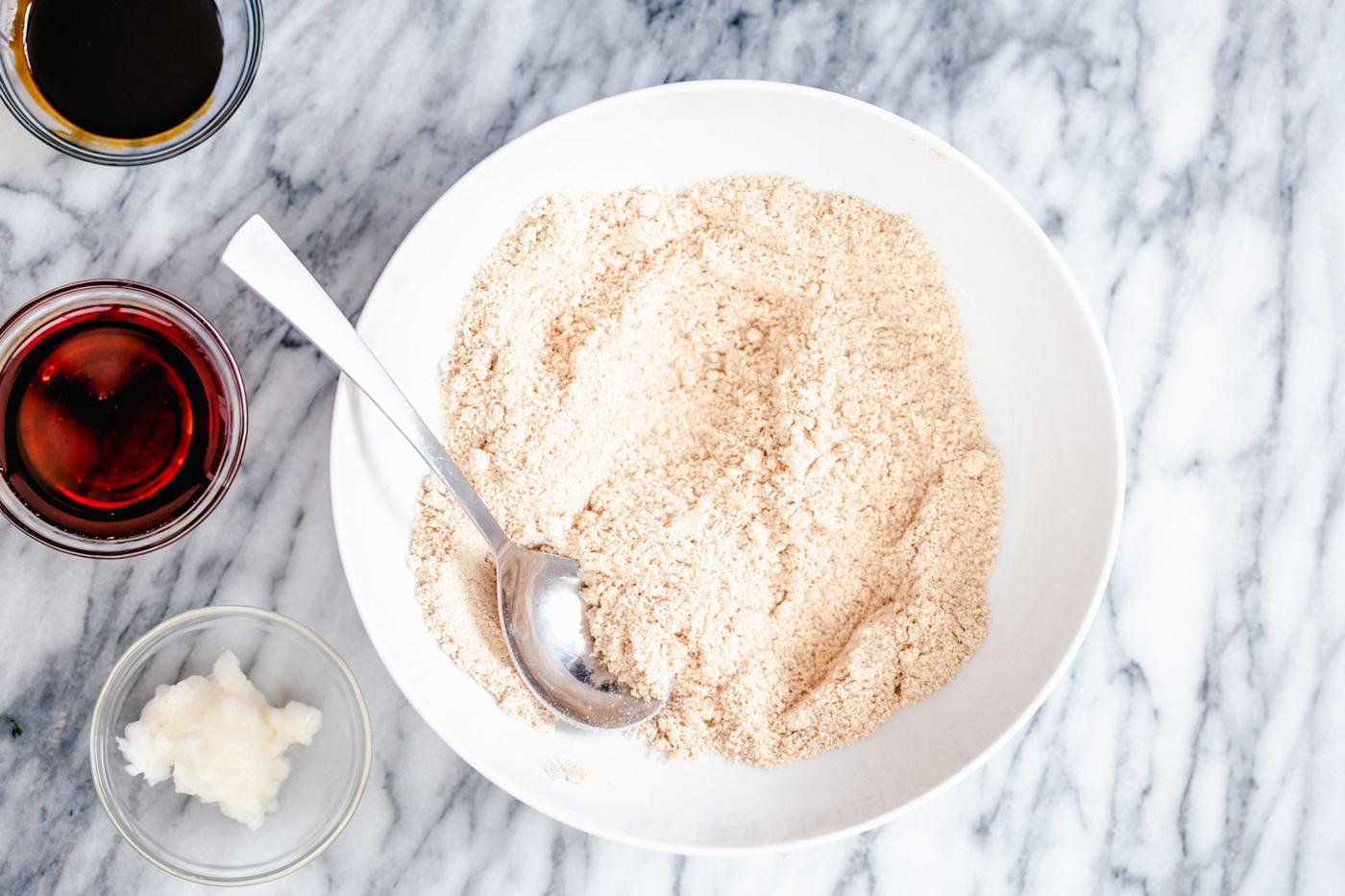 vegan gingerbread cookie batter mix in a small white bowl