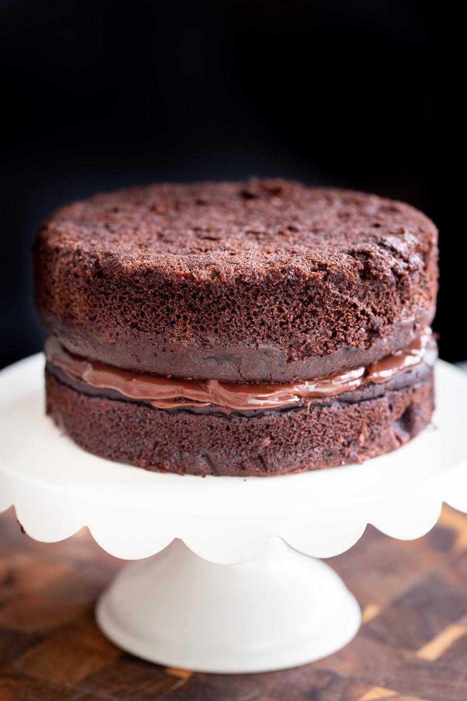 vegan chocolate layer cake filled with vegan coconut milk ganache