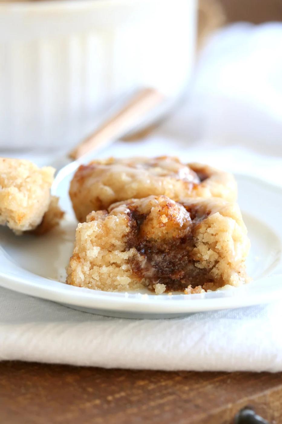 Our Vegan Gluten free Cinnamon Rolls on a white plate