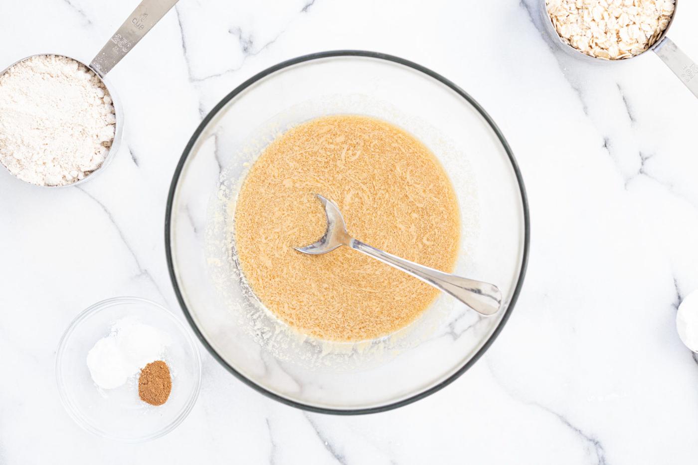Wet ingredients for our Gluten-free Tahini Oatmeal cookie in a glass bowl