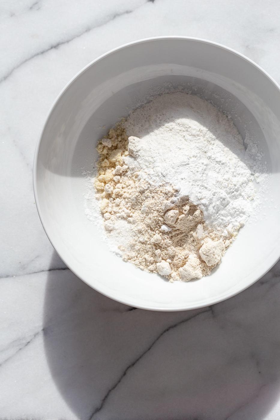 Our Vegan Gluten free Vanilla Cake ingredients in a white bowl