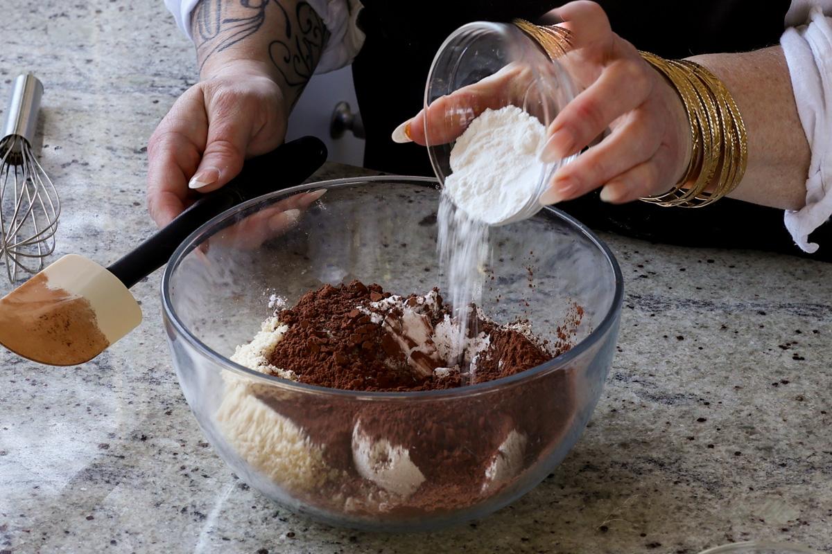 adding the dry ingredients to the bowl
