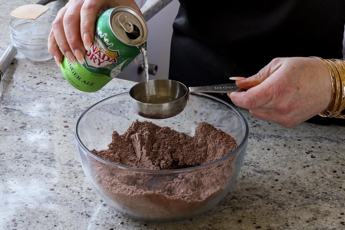 adding ginger ale to the dry ingredients