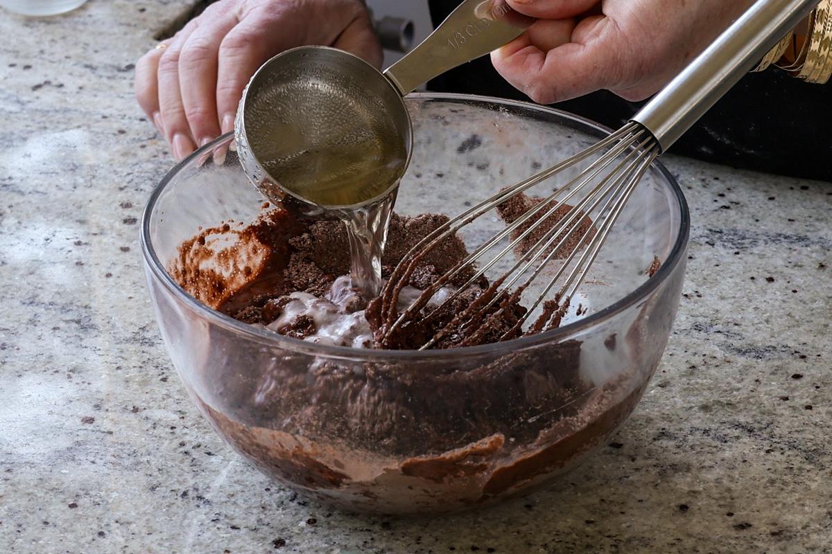 adding the remaining wet ingredients to the dry ingredients