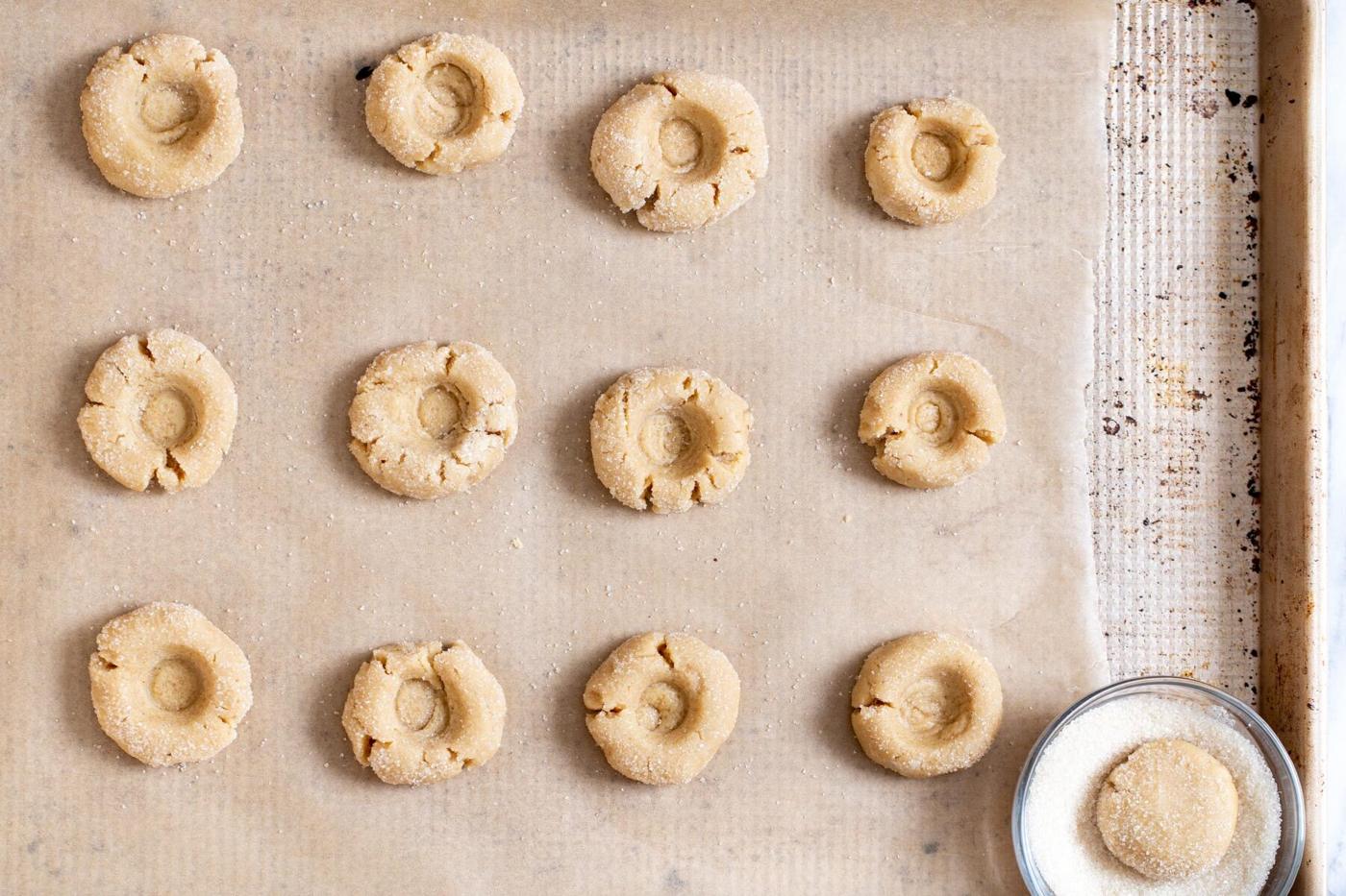 glutenfree thumbprint cookies on a baking sheet