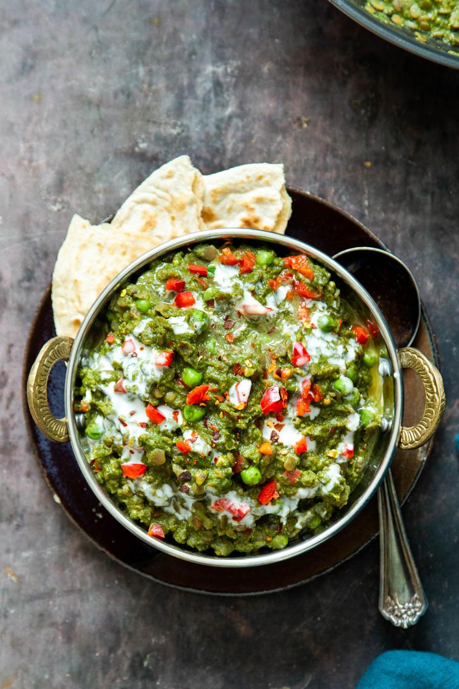 vegan green keema curry with peas served with a side of flatbread