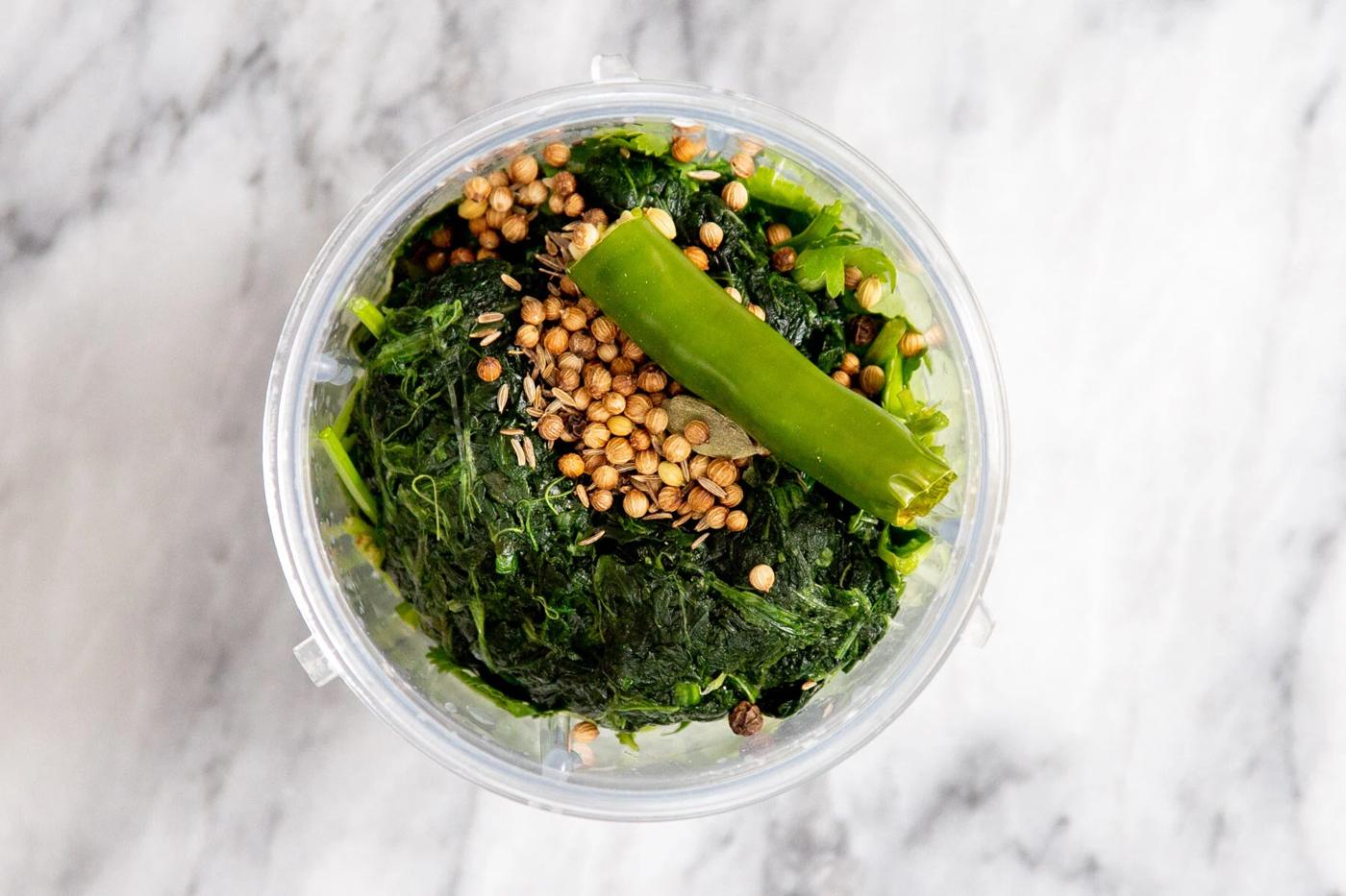 ingredients for green keema sauce in a food processor
