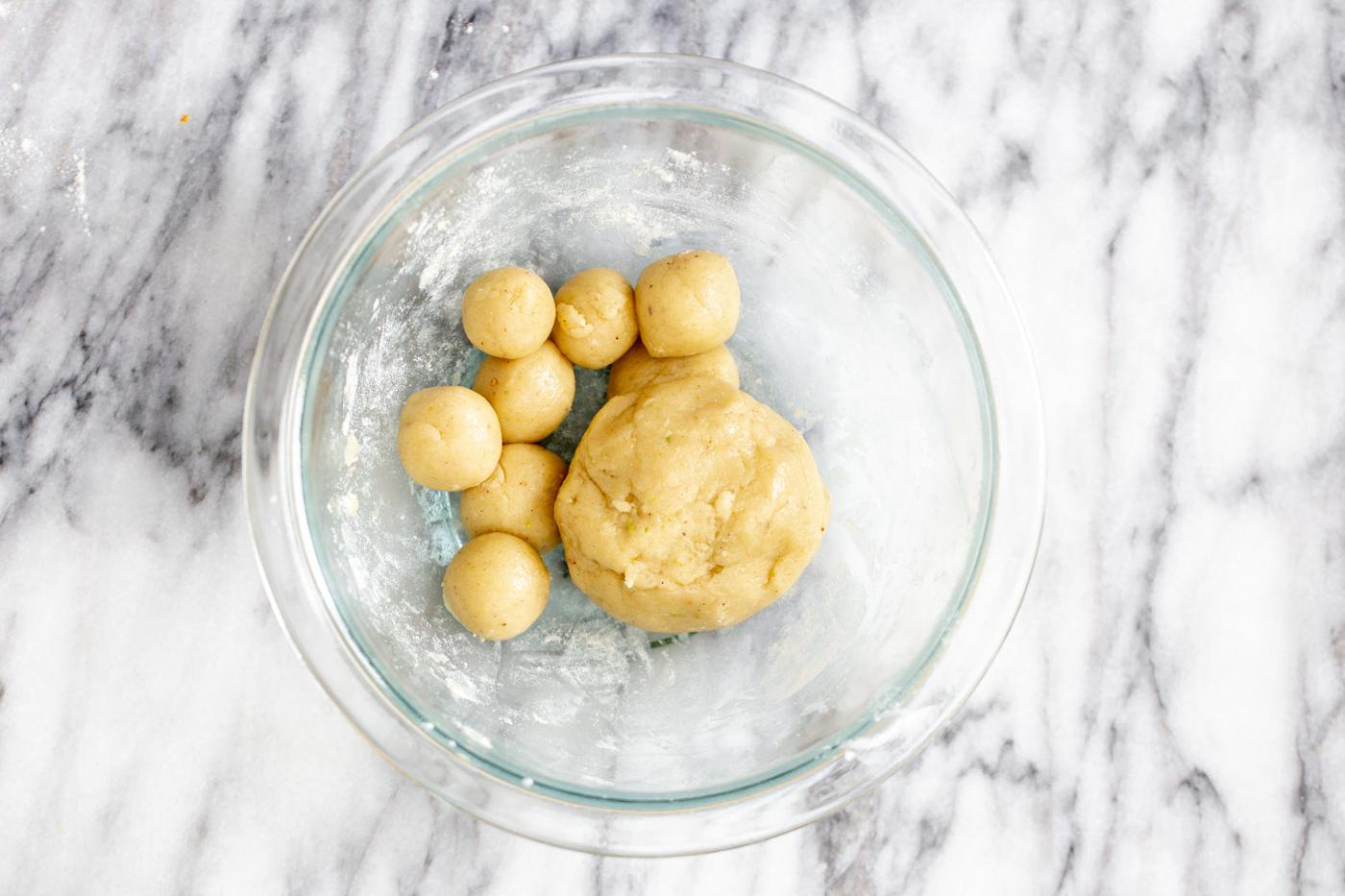 vegan gulab jamun being shaped into little dough balls