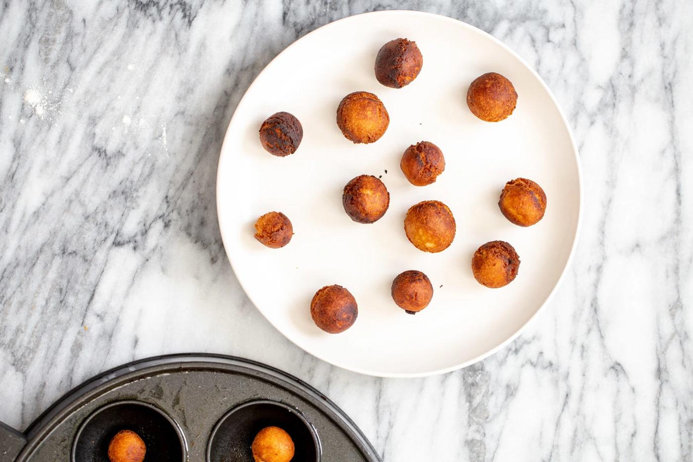 vegan gulab jamun on a white plate