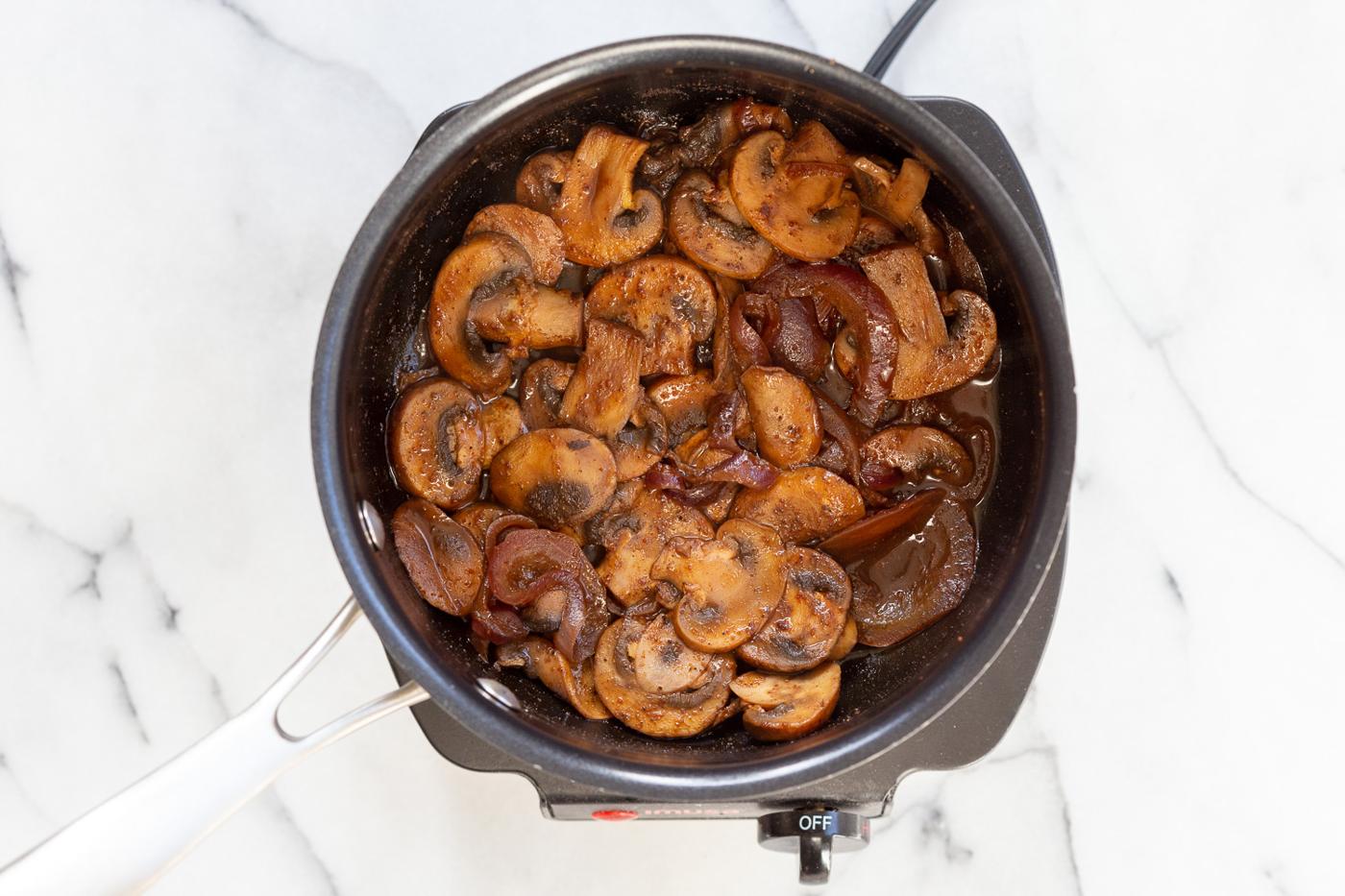 Mushrooms and sauce in saucepan for our Vegan Gyros #VeganGyros