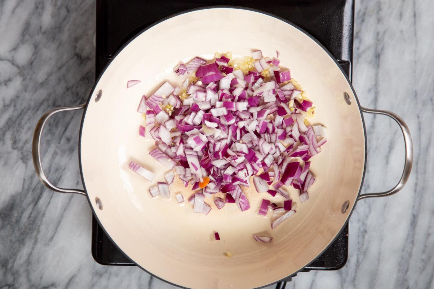 onions and garlic in a sauteeing pan