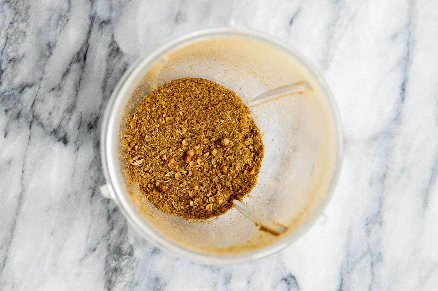 ground coriander and fennel seeds in a grinder