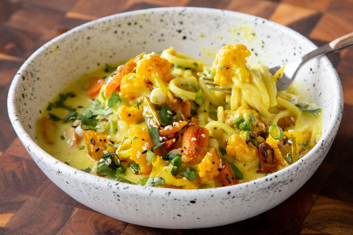 bowl of vegan kadhi pasta with veggies