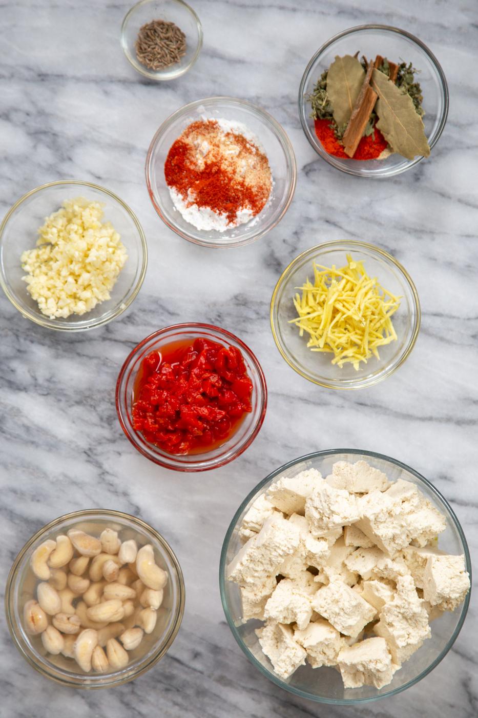 ingredients needed for making Indian Lasooni Chicken on a marble counter